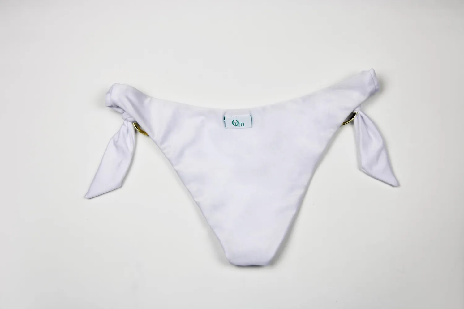 Teti Barbados slip bikini fiocchi anelli oro